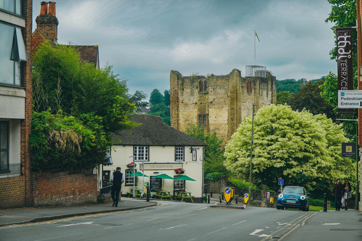 A street leads to a castle and businesses