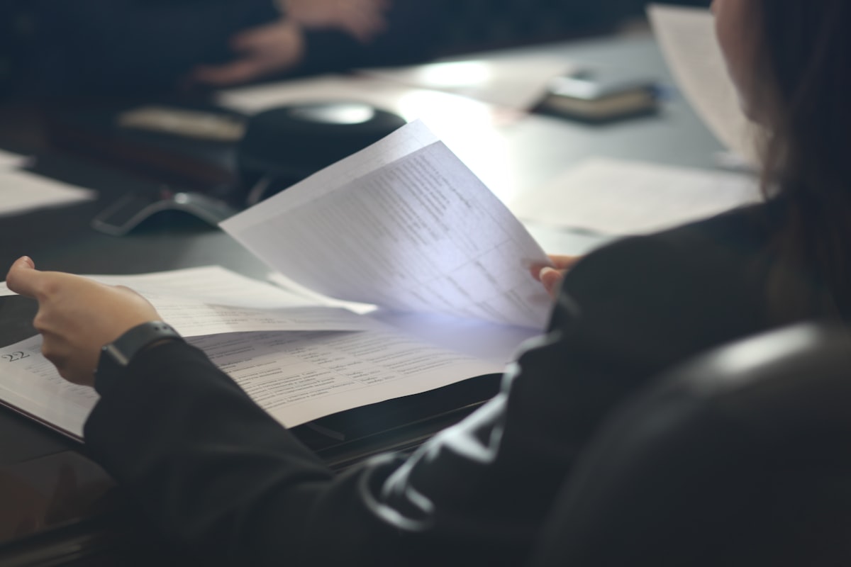 Reviewing printed documents at a desk